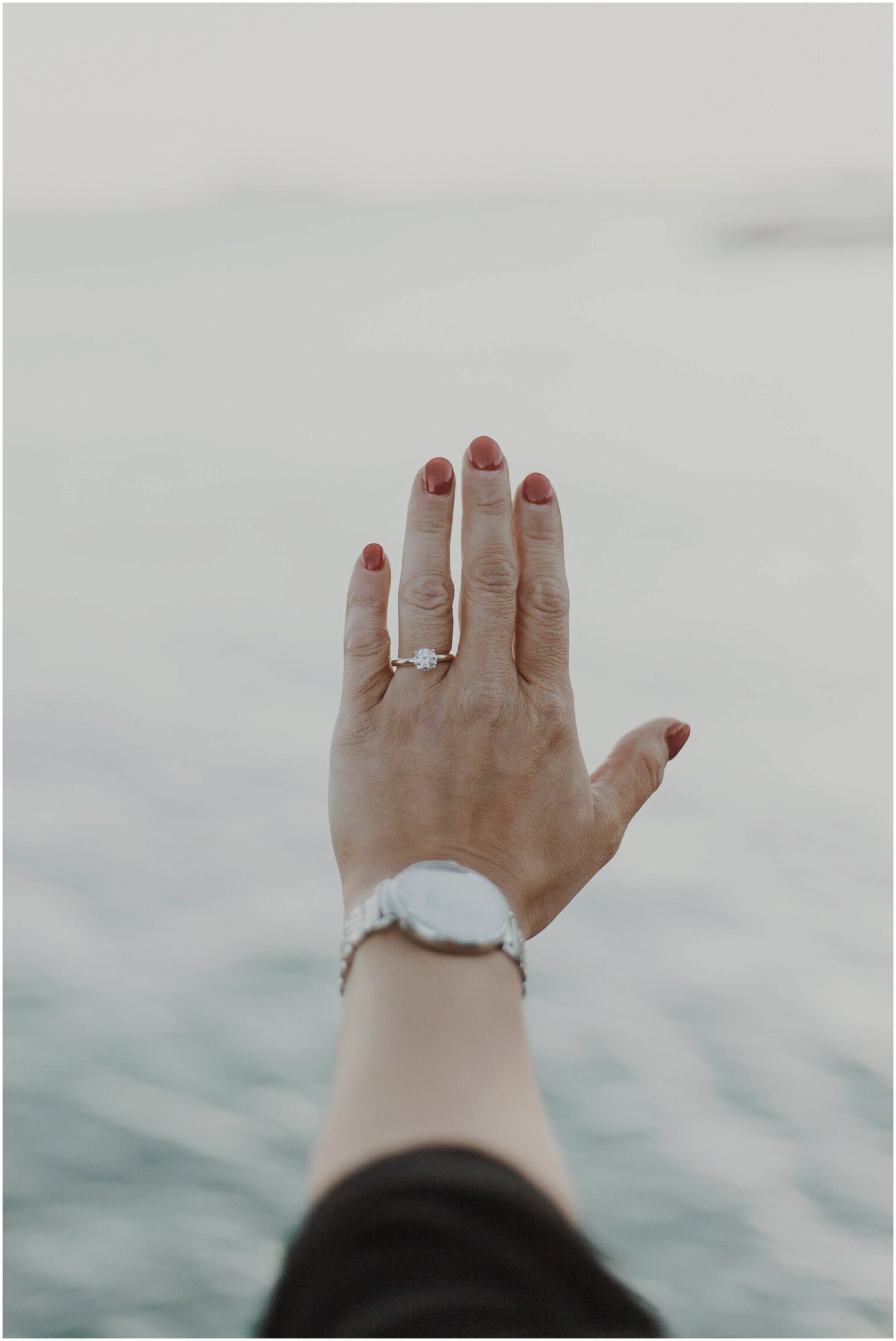 Detroit, Michigan riverwalk surprise proposal and engagement session with ring detail shot.