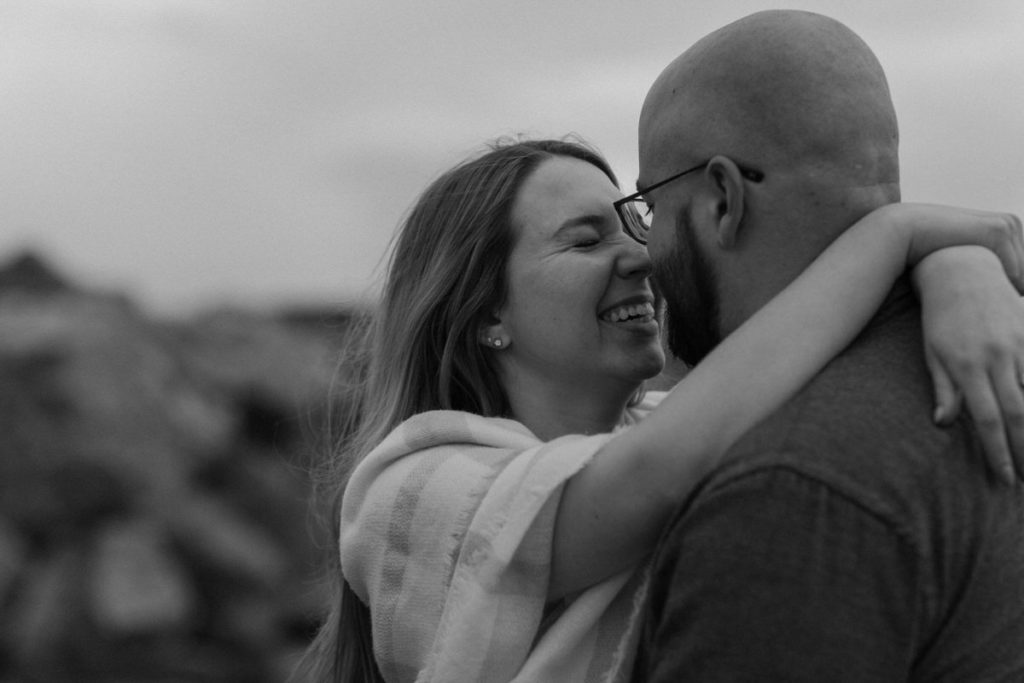 man and woman hugging and touching noses