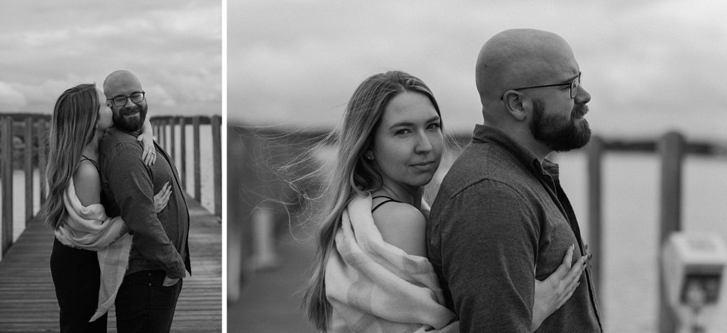 woman standing behind man with her arms around him