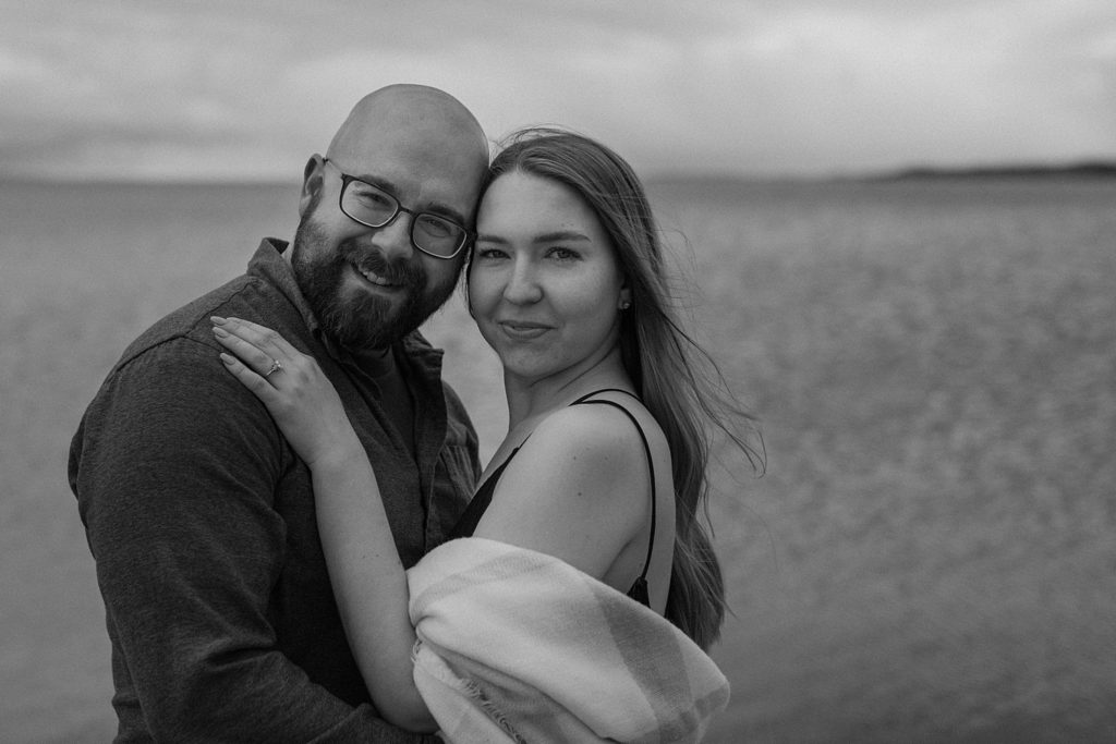 couple hugging each other with their foreheads together