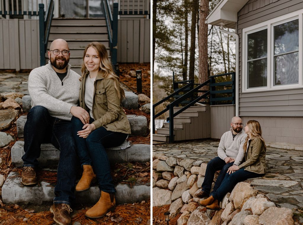 couple sitting on a rock ledge together and smiling