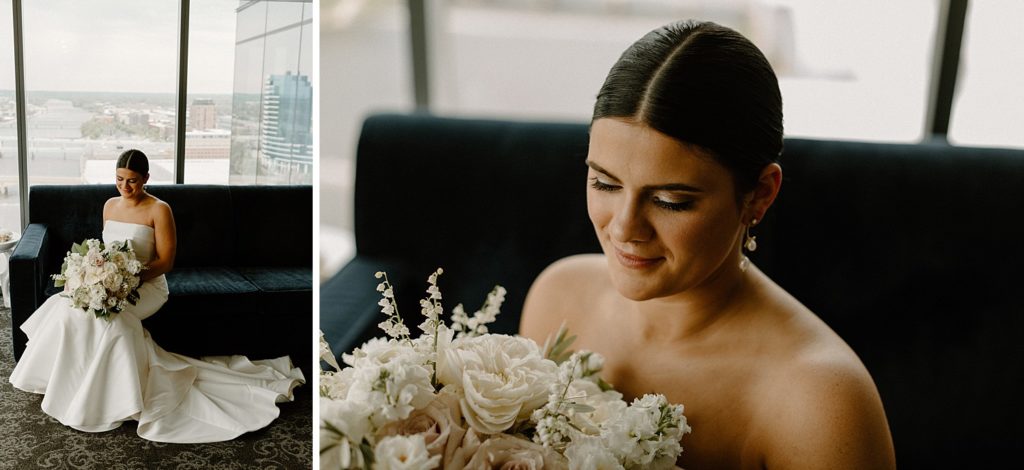 bride looking down at her bouquet of flowers 