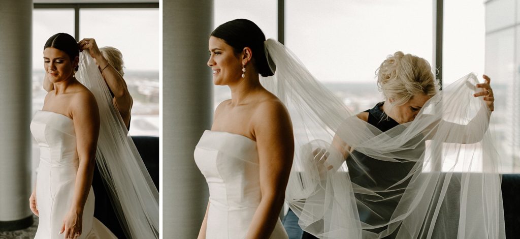 mother helping bride put on her vail 