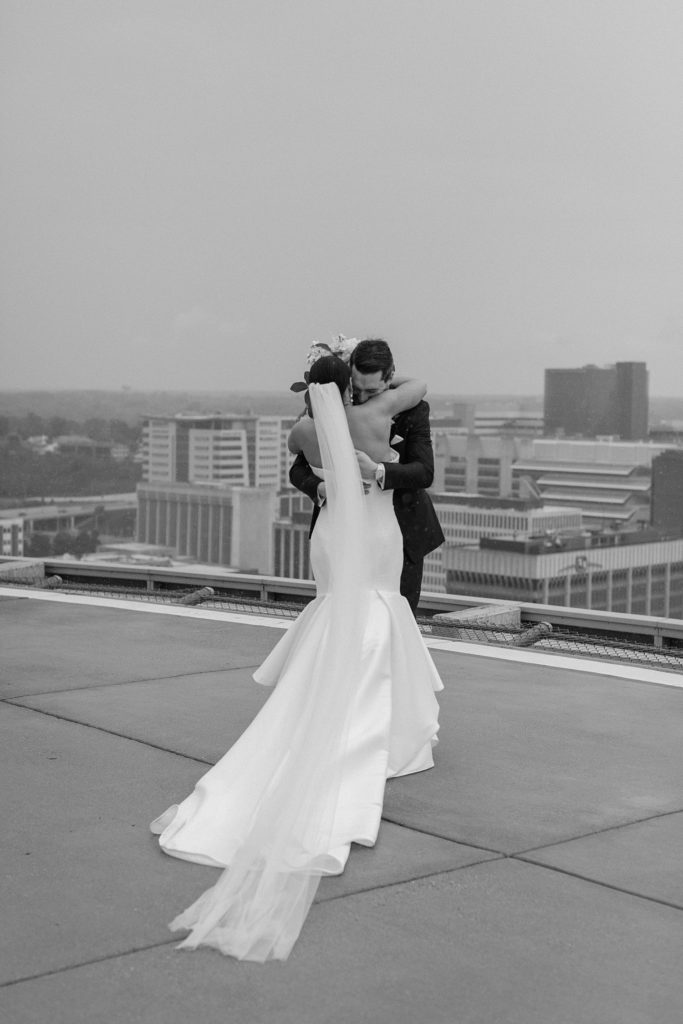 bride and groom hugging 