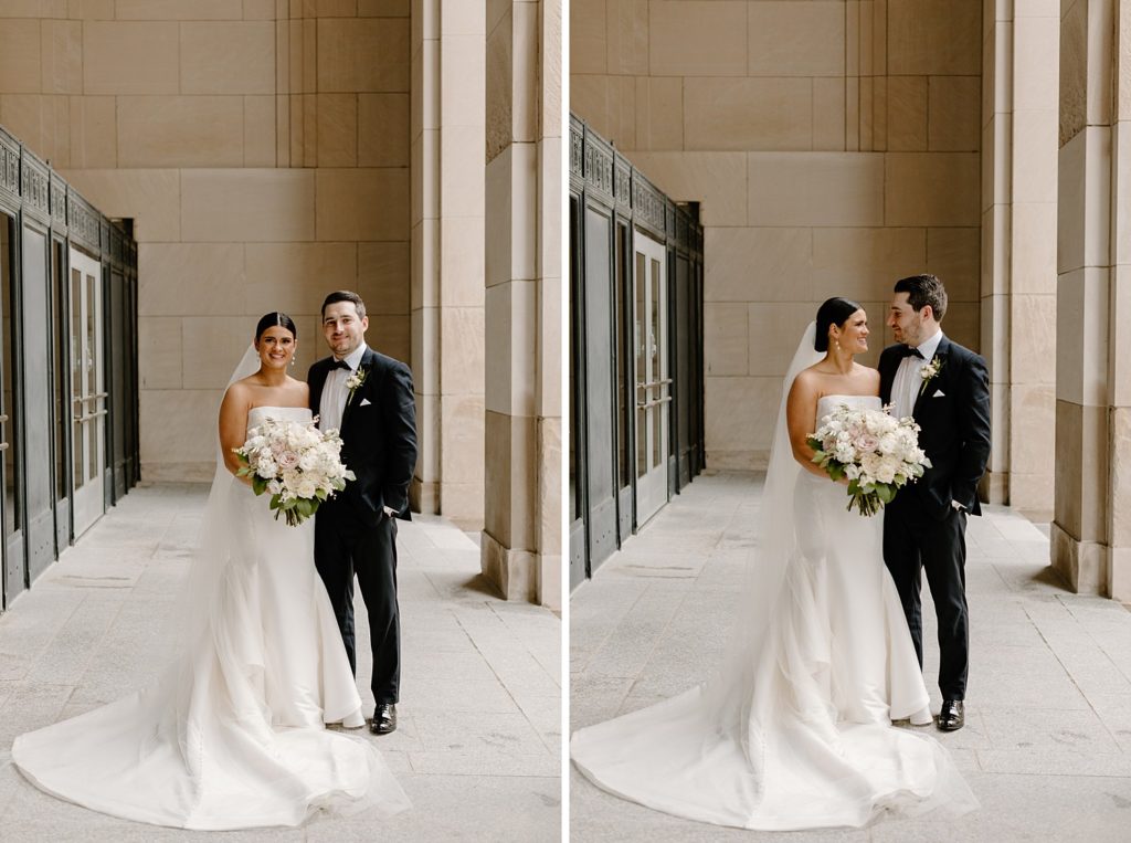 bride and groom standing next to each other looking at each other 