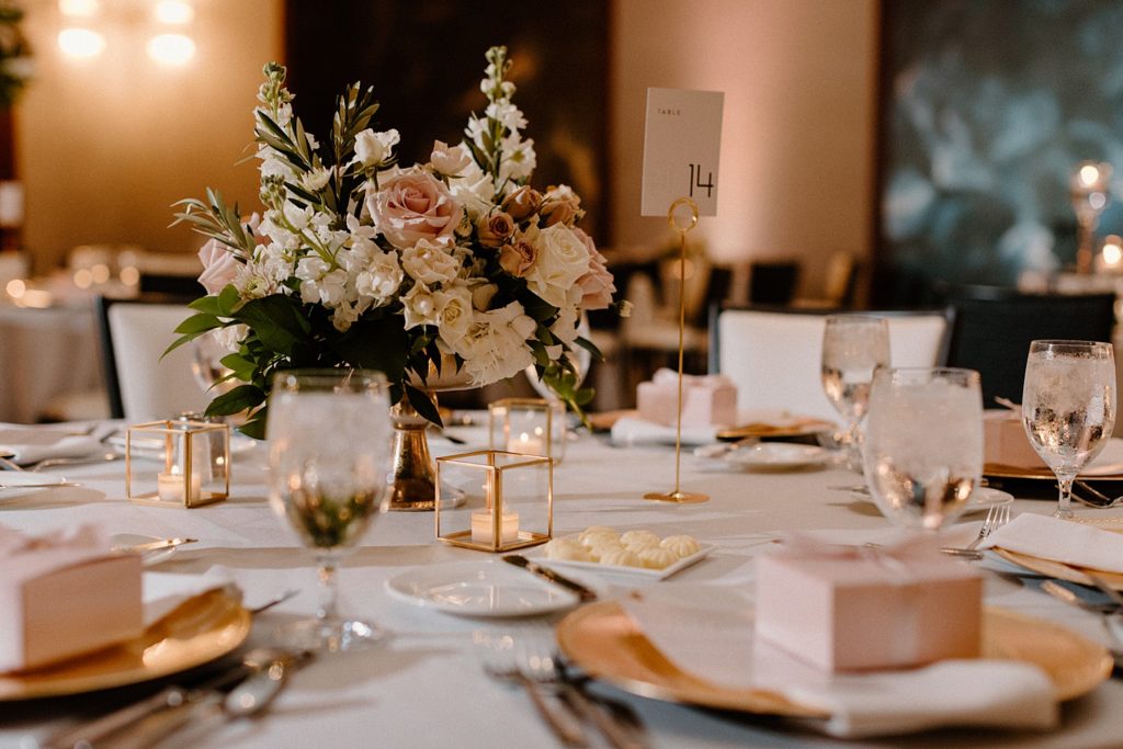 reception table centerpieces with table numbers on them 