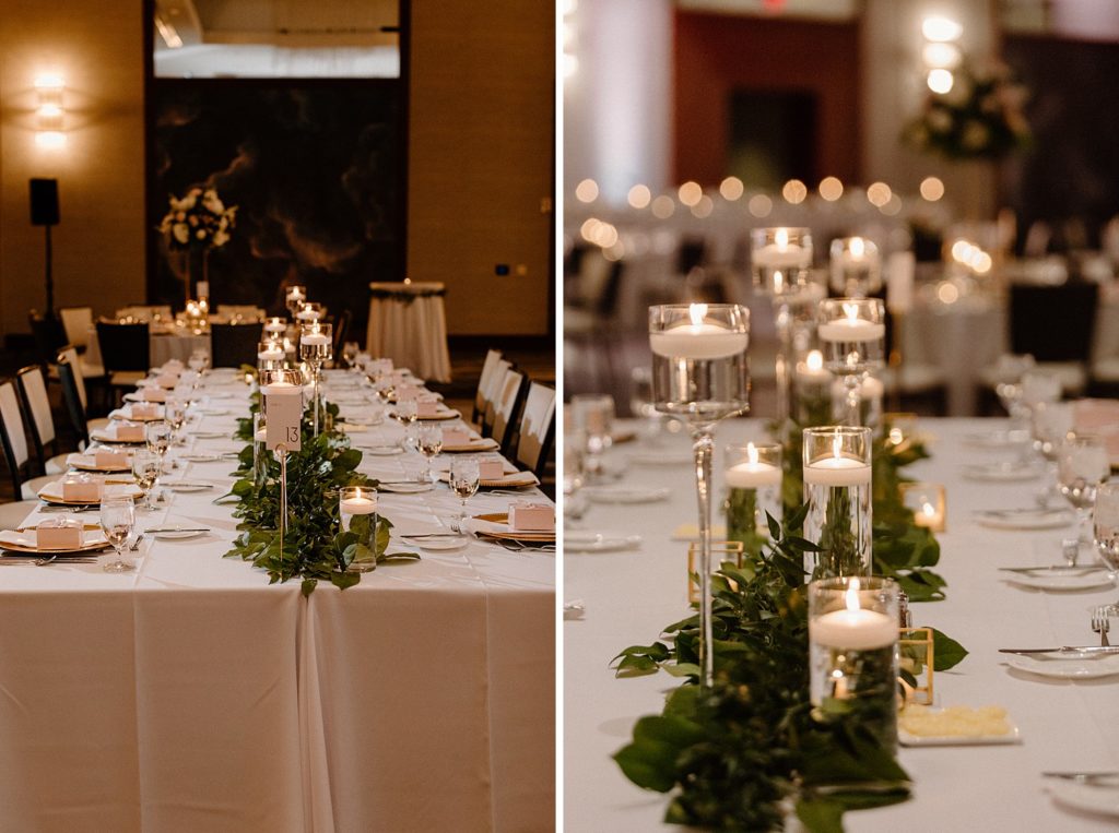 candles and green leaves down the center of a long rectangle reception table 
