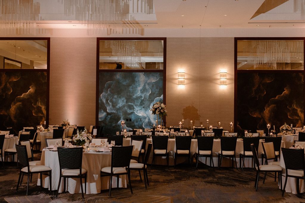 reception venue with white and black tables and chairs 