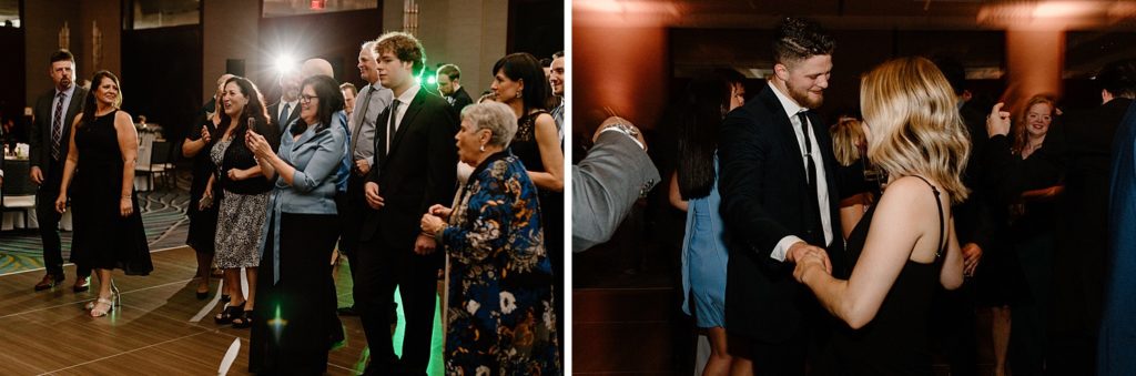 wedding guests taking pictures of people on the dance floor 
