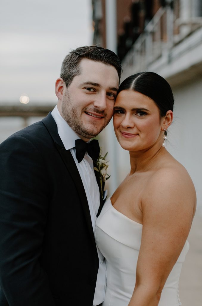 couple standing face to face and smiling 