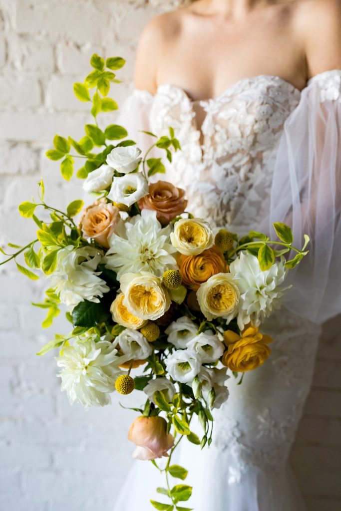 bride holding bouquet of flowers